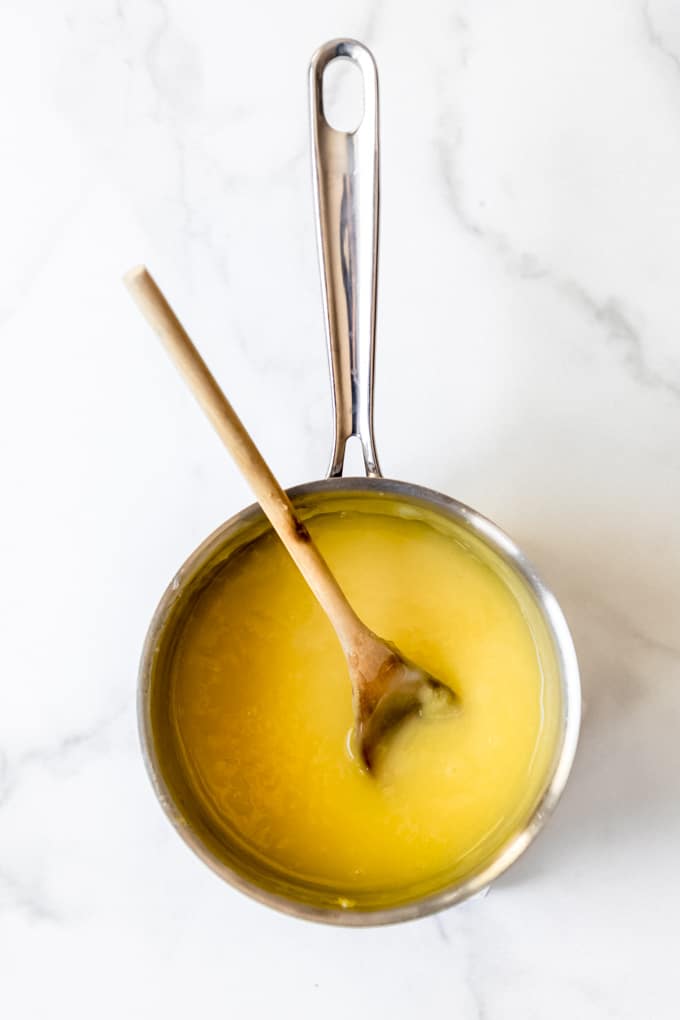 Want to make a Perfect Lemon Meringue Pie? Let us help you this great recipe and some tips and tricks! #lemonmeringuepie #meringue #pie A saucepan with lemon pie filling.