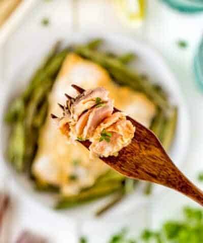 Maple Dijon Sheet Pan Salmon Dinner on a wooden fork.