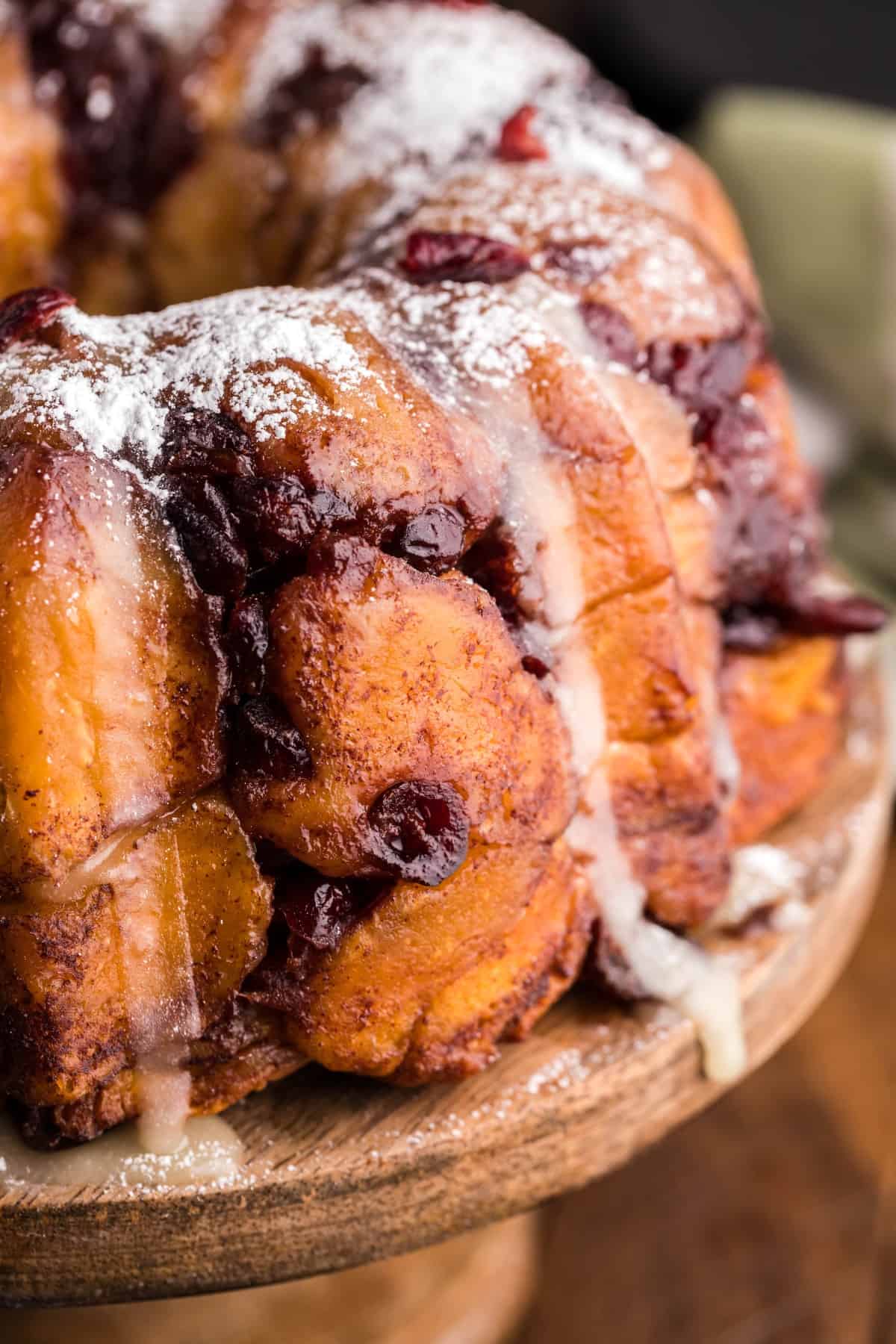 Air Fryer Holiday Monkey Bread is full of ooey-gooey caramel goodness, cinnamon and cranberries. The perfect easy holiday brunch dish. Close-up of Air Fryer Holiday Monkey Bread