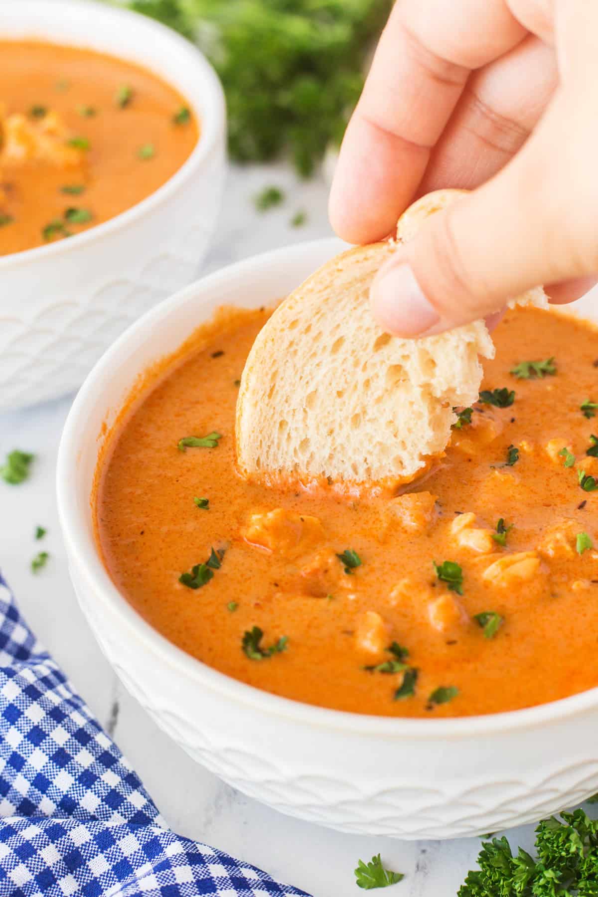 This Best Lobster Bisque Recipe is a tried and true recipe that is bursting with flavor and chunks of wonderful lobster in each bite. Dunking in a slice of bread into a bowlful of lobster bisque.