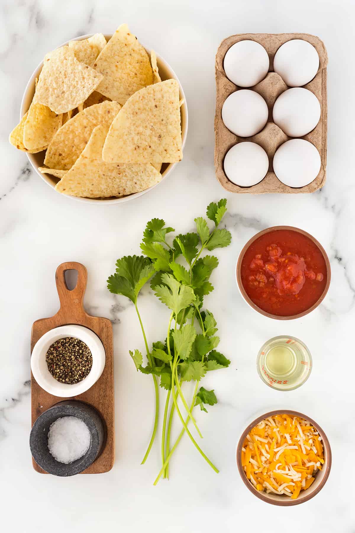 Cheesy and flavorful scrambled eggs adorn the top of crispy tortilla chips to make an unforgettable breakfast or brunch. Ingredients for Chilaquiles with Scrambled Eggs.