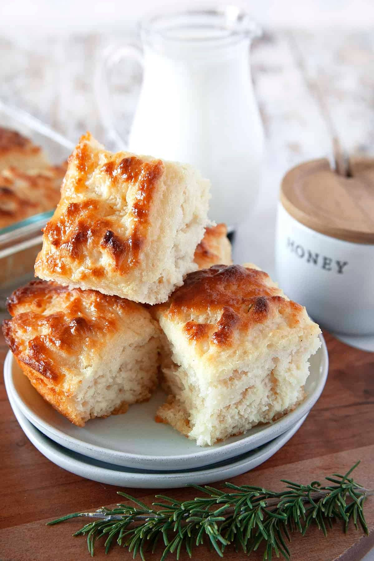 These 32 Amazing Thanksgiving/Holiday Sides will be your go to roundup for all your side dishes for family and friend celebrations for the season. Four butter swim biscuits stacked on a small plate.