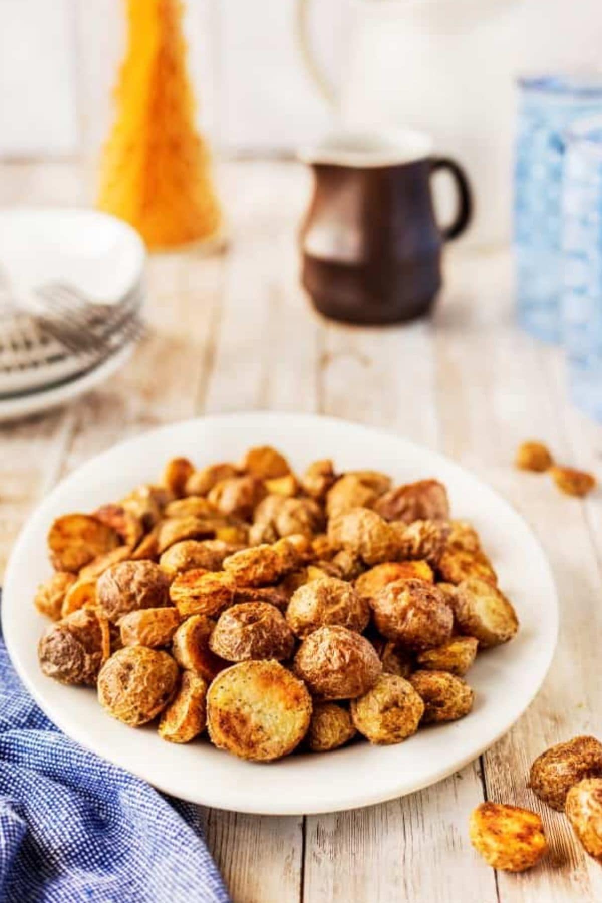 These 32 Amazing Thanksgiving/Holiday Sides will be your go to roundup for all your side dishes for family and friend celebrations for the season. Plate full of crispy roasted potatoes on a counter.