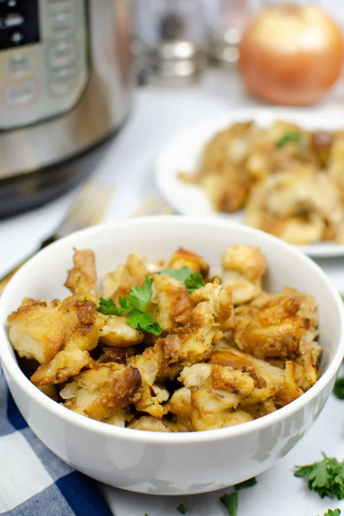 These 32 Amazing Thanksgiving/Holiday Sides will be your go to roundup for all your side dishes for family and friend celebrations for the season. Bowl full of Instant Pot Stuffing ready to serve on a counter.