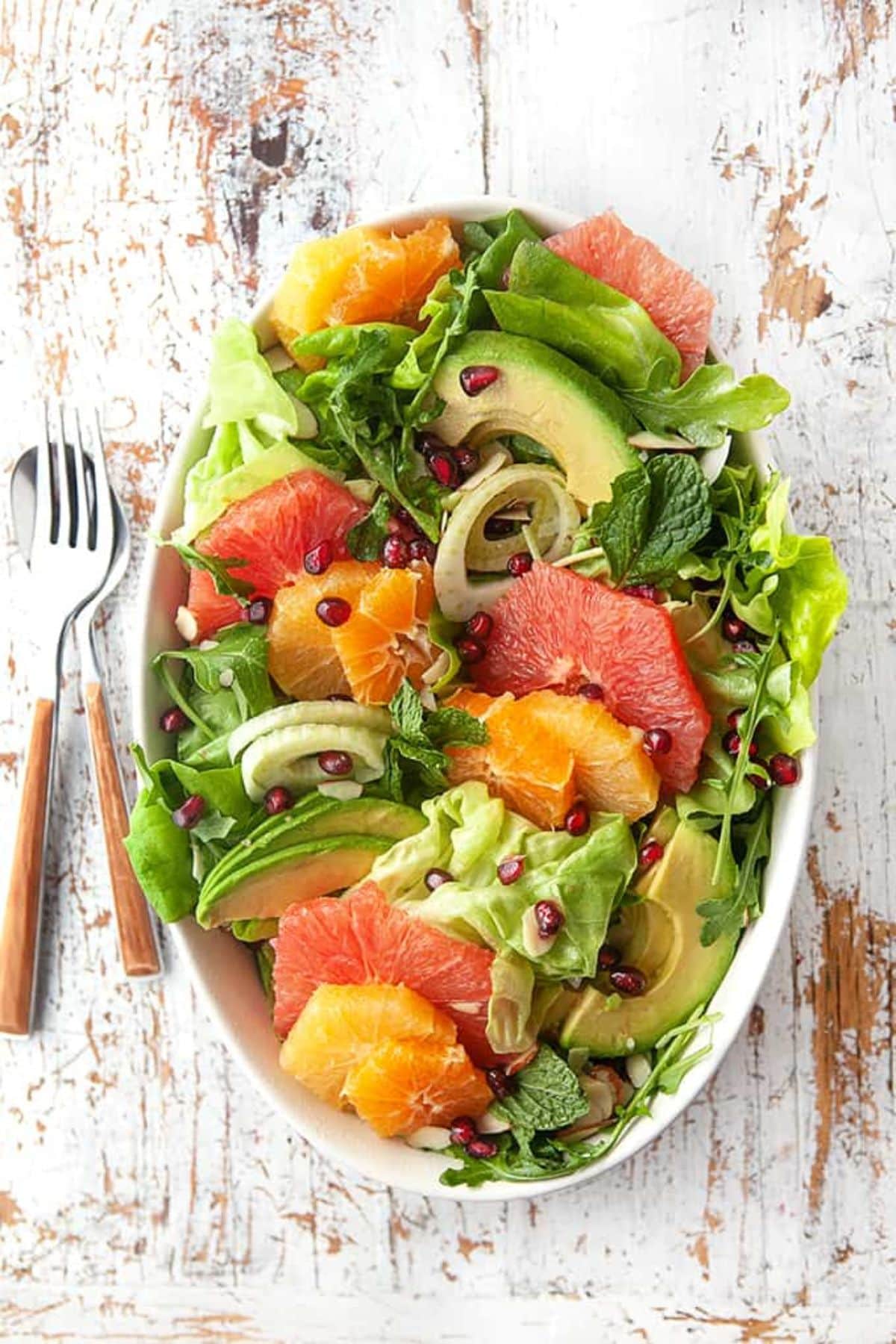 These 32 Amazing Thanksgiving/Holiday Sides will be your go to roundup for all your side dishes for family and friend celebrations for the season. Large serving bowl full of winter citrus salad.