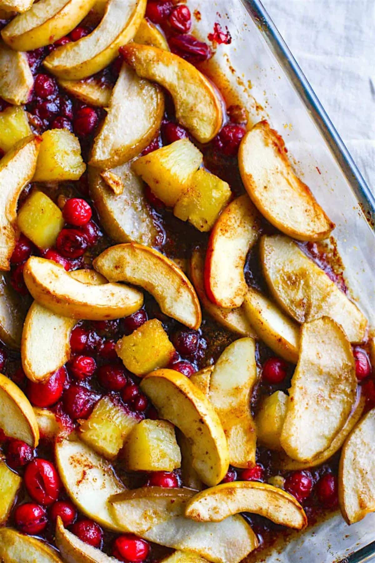 These 35 Scrumptious Make Ahead Brunch Casseroles will make your life over the holidays so much easier. Plus, everyone will be delighted with any one of these casseroles for the holidays. Spiced hot fruit in dish.